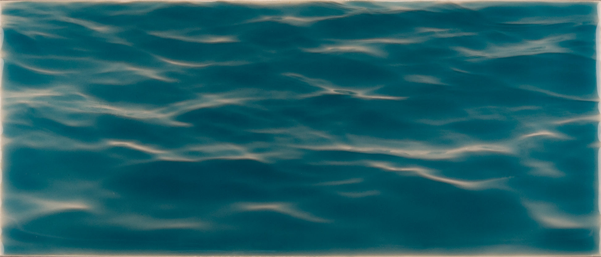 Beach-themed bathroom tile mural featuring serene blue water ripples, ideal for creating a coastal vibe in home decor.