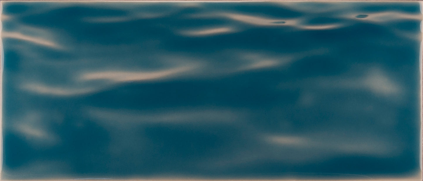 Beach-themed bathroom tile mural in deep blue, resembling tranquil ocean waves, ideal for creating a coastal vibe in home decor.