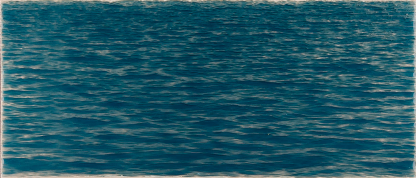 Beach-themed bathroom tile mural featuring deep blue ocean waves, enhancing coastal decor for a relaxing atmosphere.