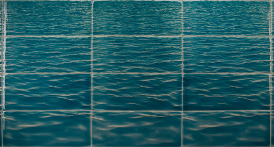 Beach-themed bathroom tile mural featuring a serene, textured ocean wave design, ideal for enhancing home decor with a coastal vibe.