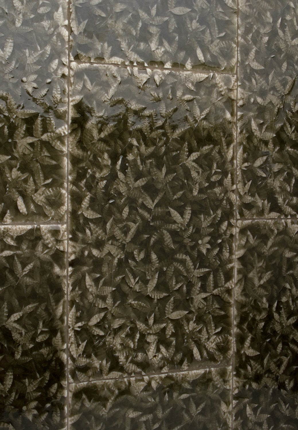 Leaf-patterned decorative wall tiles inspired by nature, showcasing intricate designs resembling tropical foliage, ideal for enhancing home interiors.