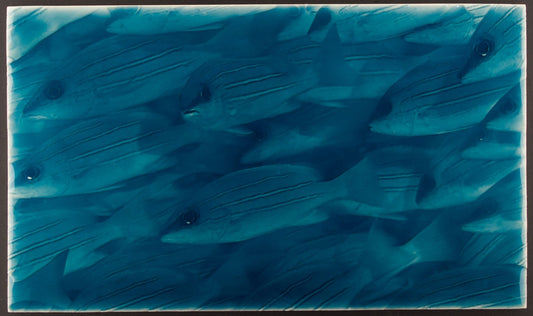 Little Fish Tile design featuring a group of stylized fish in varying shades of blue, ideal for coastal-themed bathroom decor.