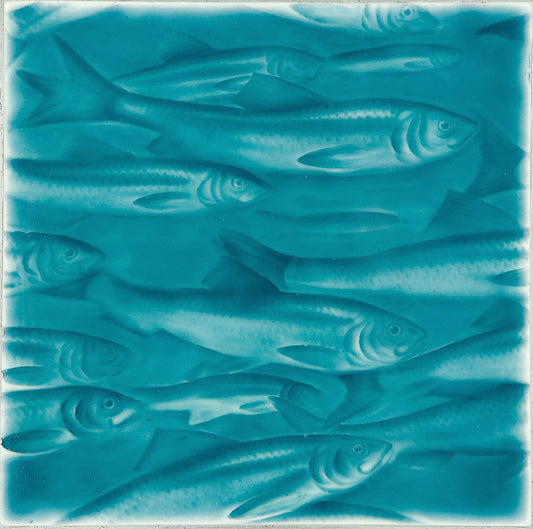Artisan tile featuring a design of swimming fish in ocean-inspired turquoise hues, ideal for coastal bathroom decor.