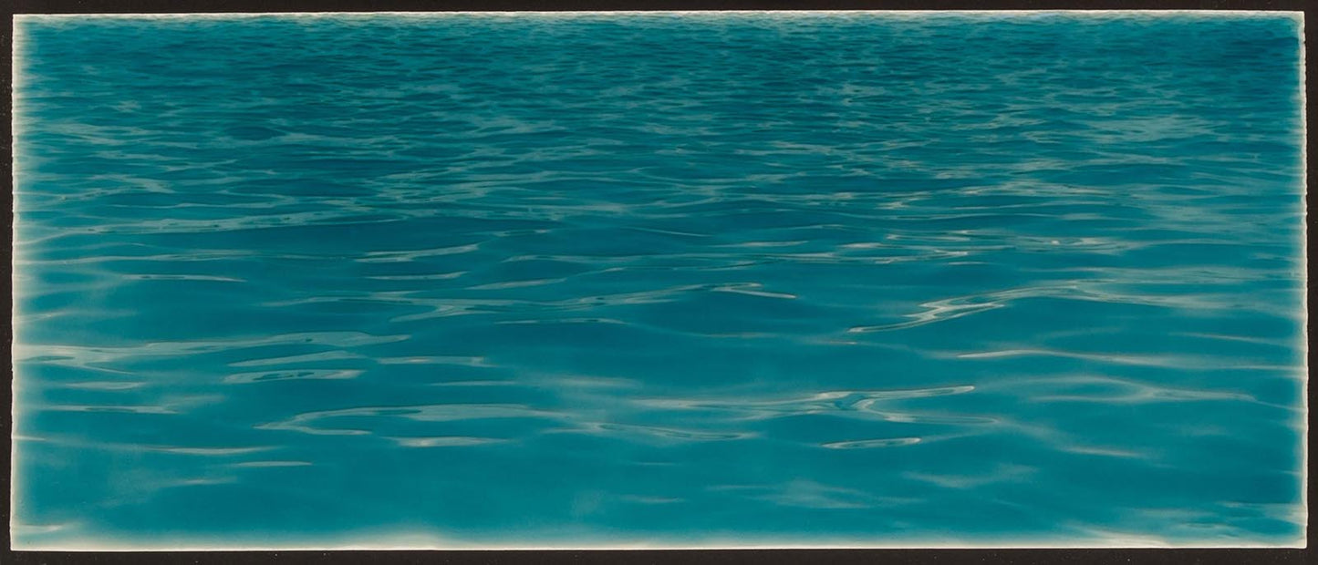 Tranquil ocean water backsplash tile mural, ideal for beach-themed bathroom decor, showcasing soothing blue hues and gentle wave patterns.