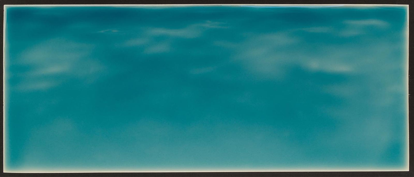 Tranquil ocean water backsplash tile mural in vibrant turquoise, ideal for beach-themed bathroom decor.