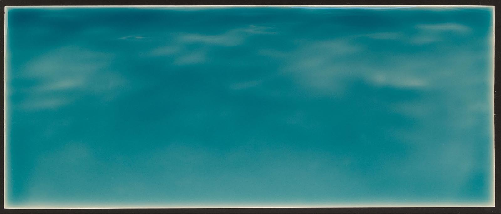 Tranquil ocean water backsplash tile mural in vibrant turquoise, ideal for beach-themed bathroom decor.