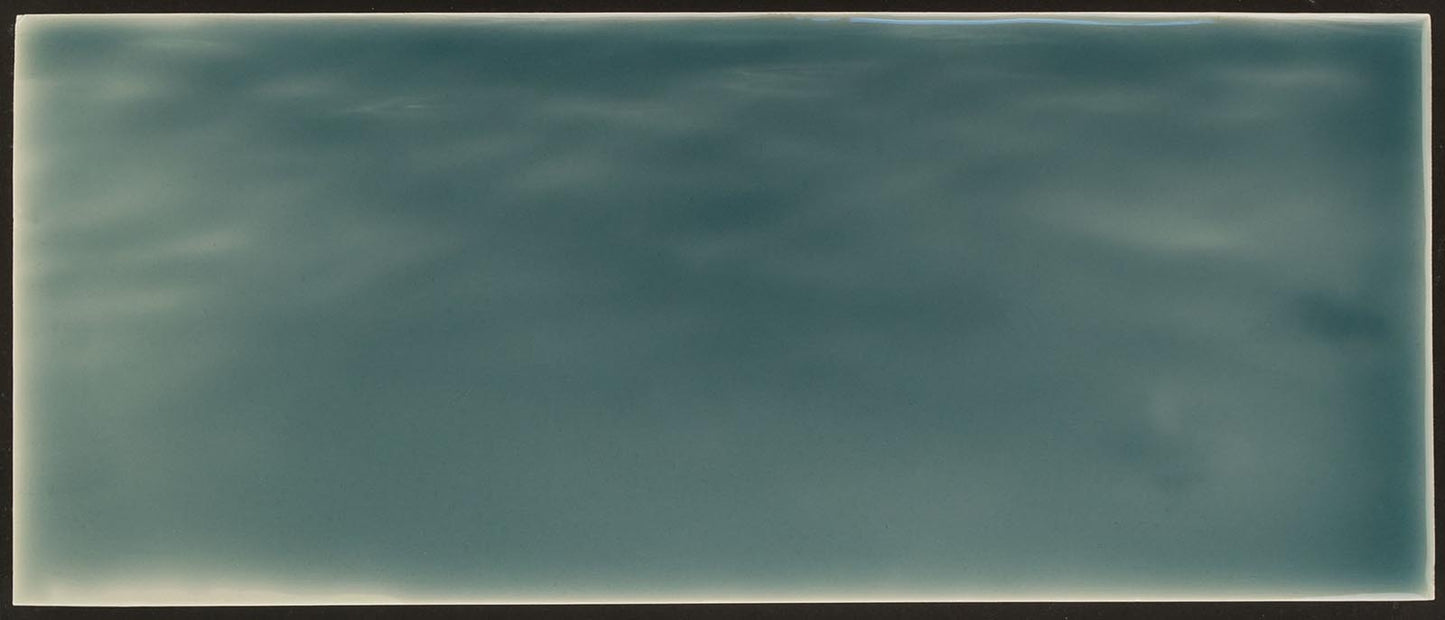 Beach-themed bathroom tile backsplash in ocean water hues, featuring tranquil blue tones and a glossy finish, ideal for home decor inspiration.