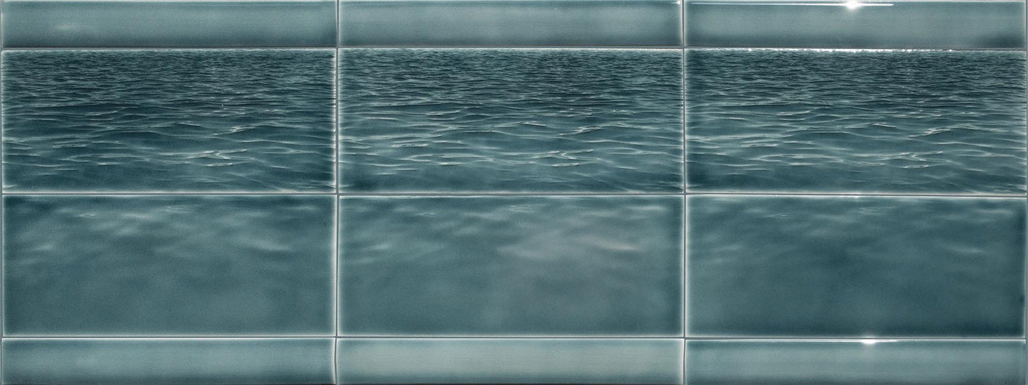Ocean water-themed tile mural designed for kitchen backsplash, featuring serene blue tones and a textured wave pattern, ideal for beach-themed bathroom decor.