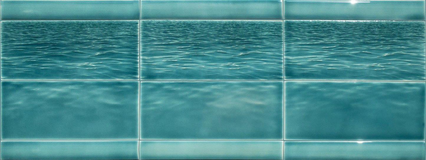 Ocean water-themed tile mural showcasing tranquil blue waves, ideal for beach-themed bathroom backsplash inspiration from Living Walls Tile.