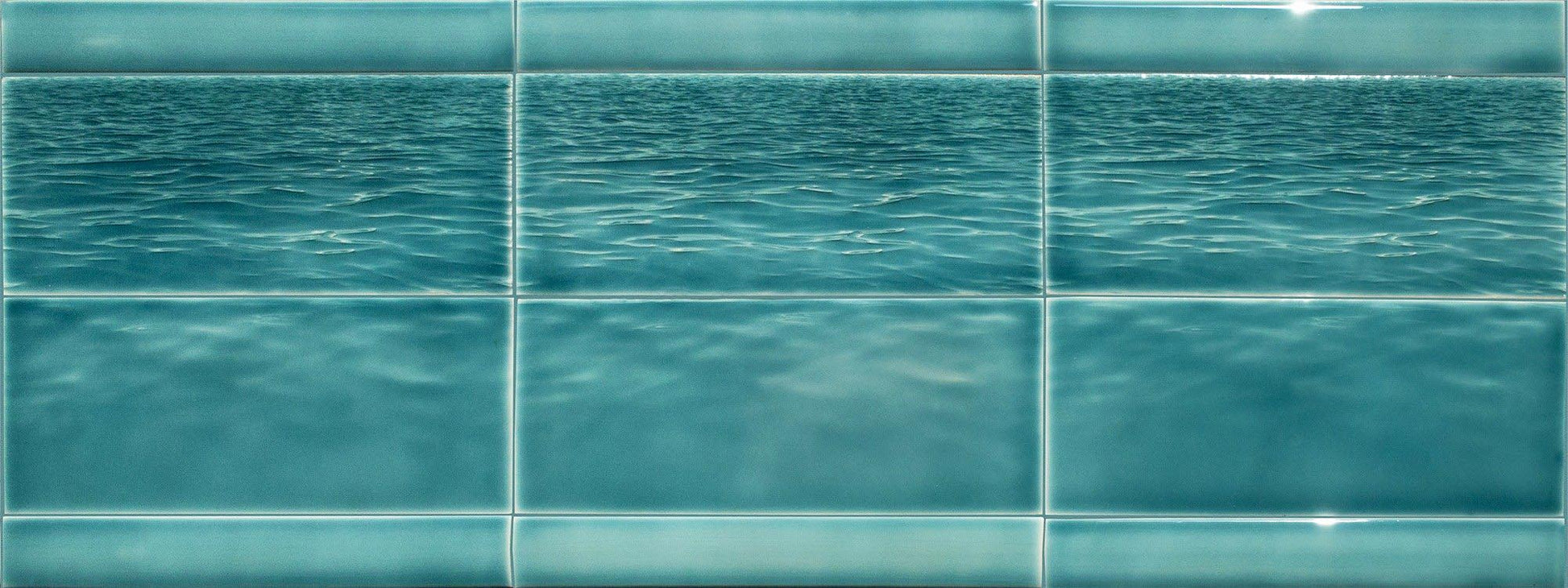 Ocean water-themed tile mural showcasing tranquil blue waves, ideal for beach-themed bathroom backsplash inspiration from Living Walls Tile.
