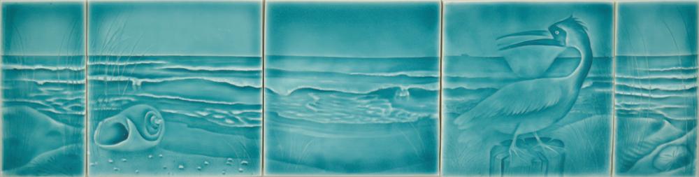 Beach-themed ceramic art tile set featuring ocean waves, seashell, and a heron, designed for coastal bathroom decor by Living Walls Tile.