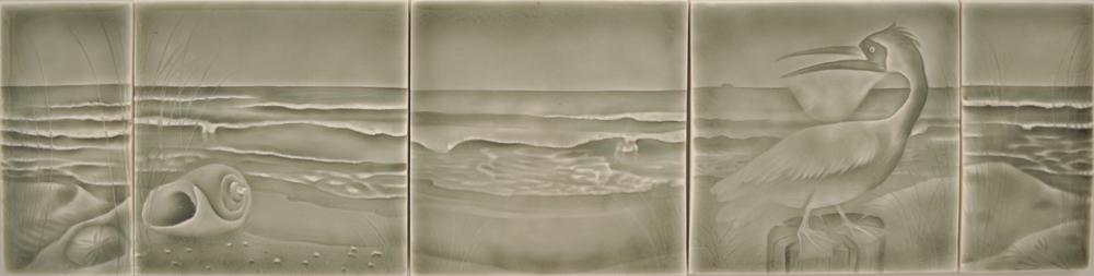 Beach-themed ceramic tile artwork featuring ocean waves, seashells, and a heron, ideal for coastal bathroom decor.