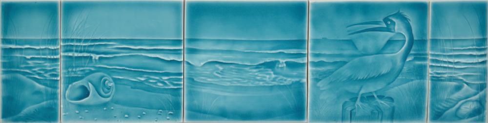 Beach-themed ceramic tile set featuring ocean waves, seashells, and a heron, ideal for enhancing coastal aesthetics in bathroom decor.