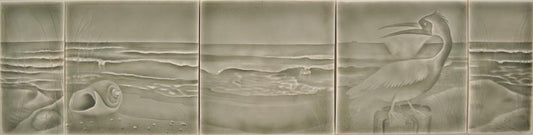 Beach-themed ceramic tile artwork featuring a coastal scene with waves, seashells, and a heron, ideal for creating a coastal vibe in bathroom decor.